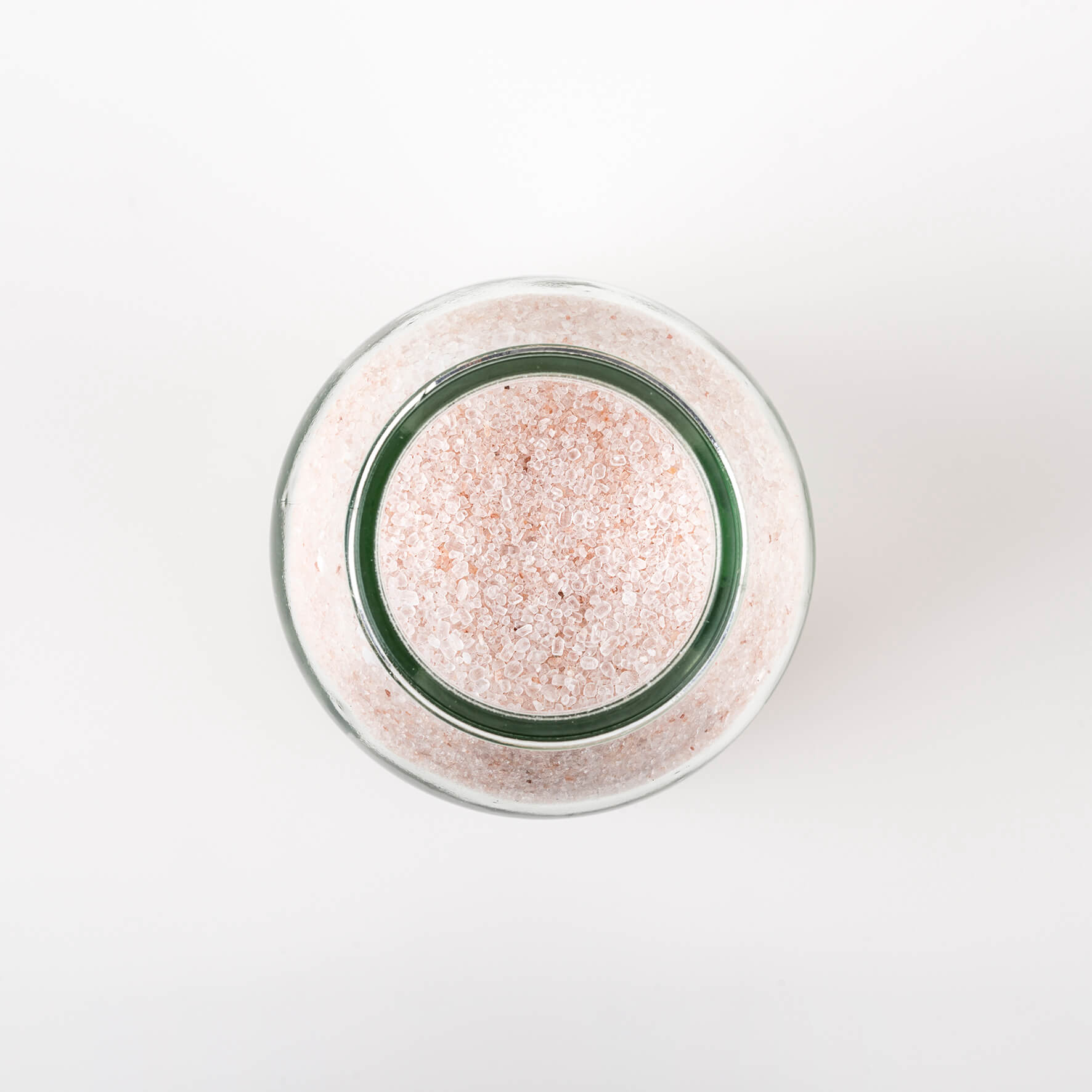 The top view of Bristolmade Cleansing Bath Salts, showing the pale pink grains of Himalayan and Epsom salts.