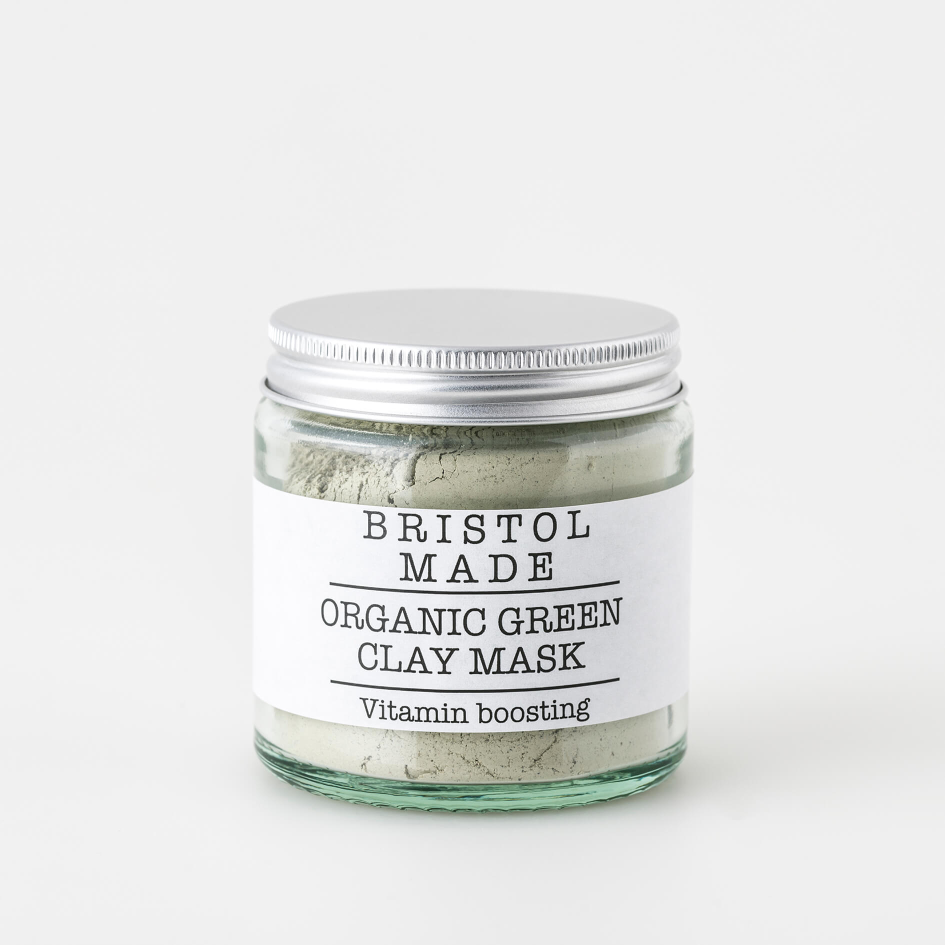 A 120ml jar of Bristolmade Green Clay Mask, featuring a white label with black text, fine green clay, for deep cleansing and detoxifying of the skin. 