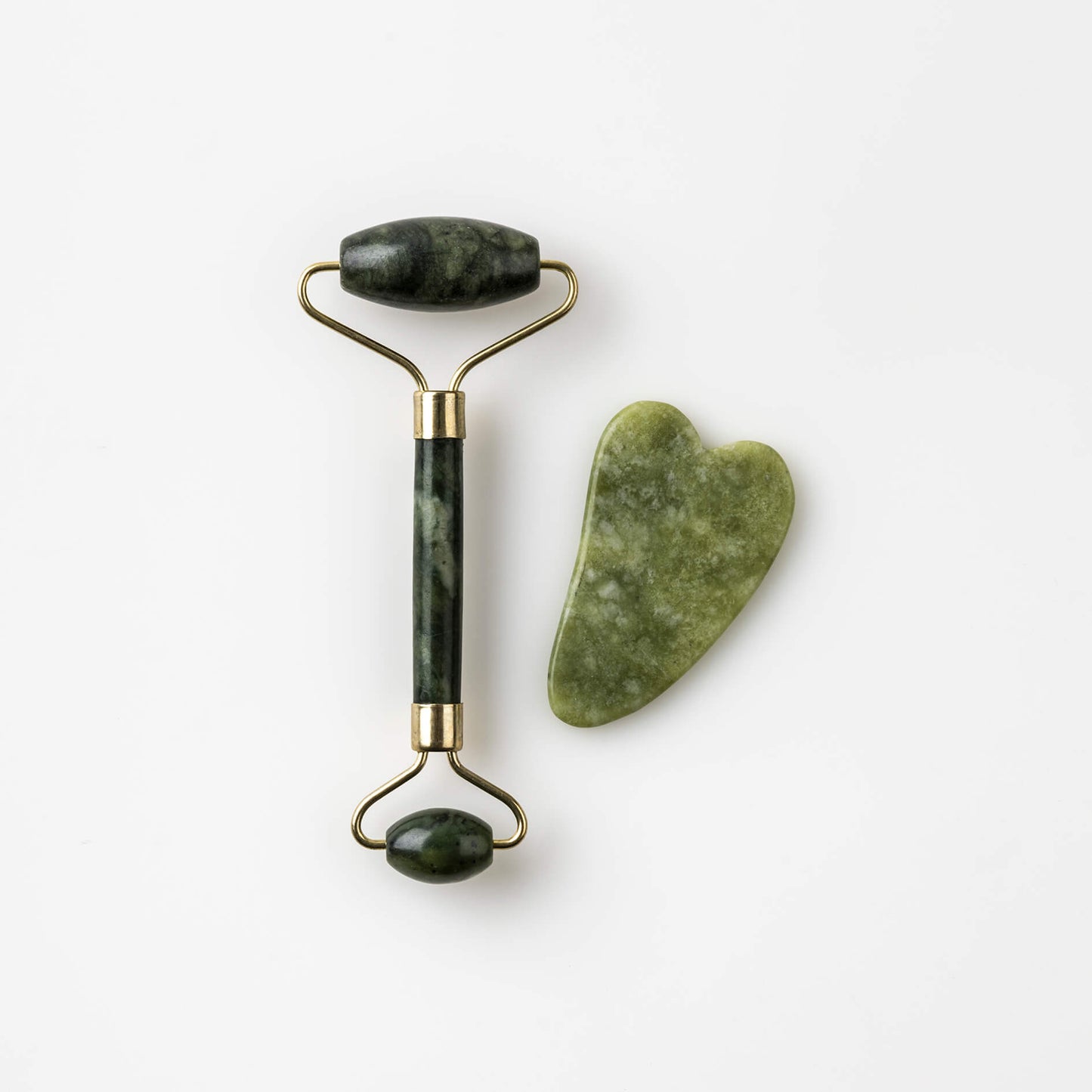 A Bristolmade jade roller and gua sha set, featuring smooth green jade rollers with gold coloured fittings and a matching jade gua sha tool, both designed for facial massage and skincare.